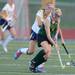 Huron's Leah Davis and Saline's Jillian Santos fight for control of the ball during the first half at Saline on Thursday night. Melanie Maxwell I AnnArbor.com